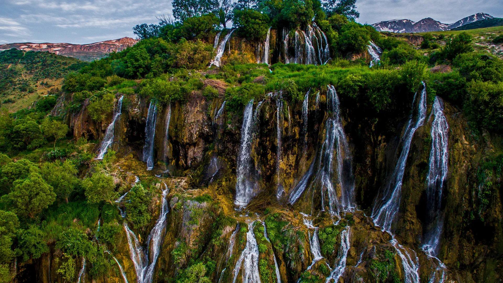 Be mesmerized by the cascading beauty of Girlevik Waterfall, a natural wonder in a picturesque setting. banner image